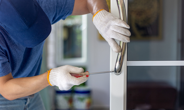 man installing door handle