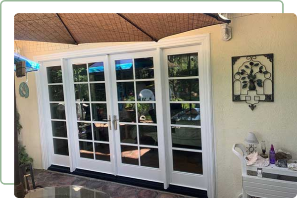 dining room surounded by tall windows