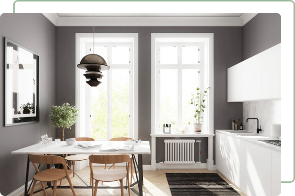 small kitchenette with two ceiling height windows on back wall